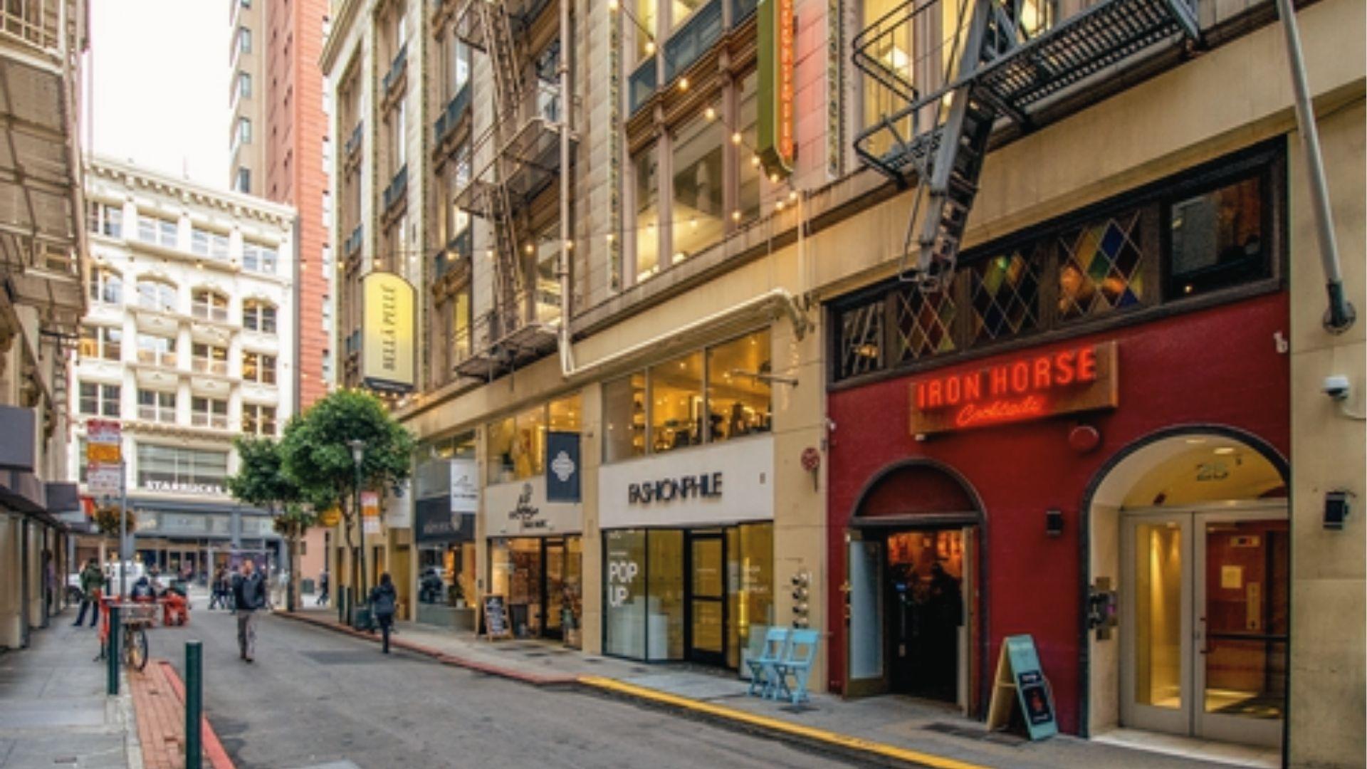 Historic Golden Gate Theatre glows on Market Street as spring light hits San Francisco's skyline.