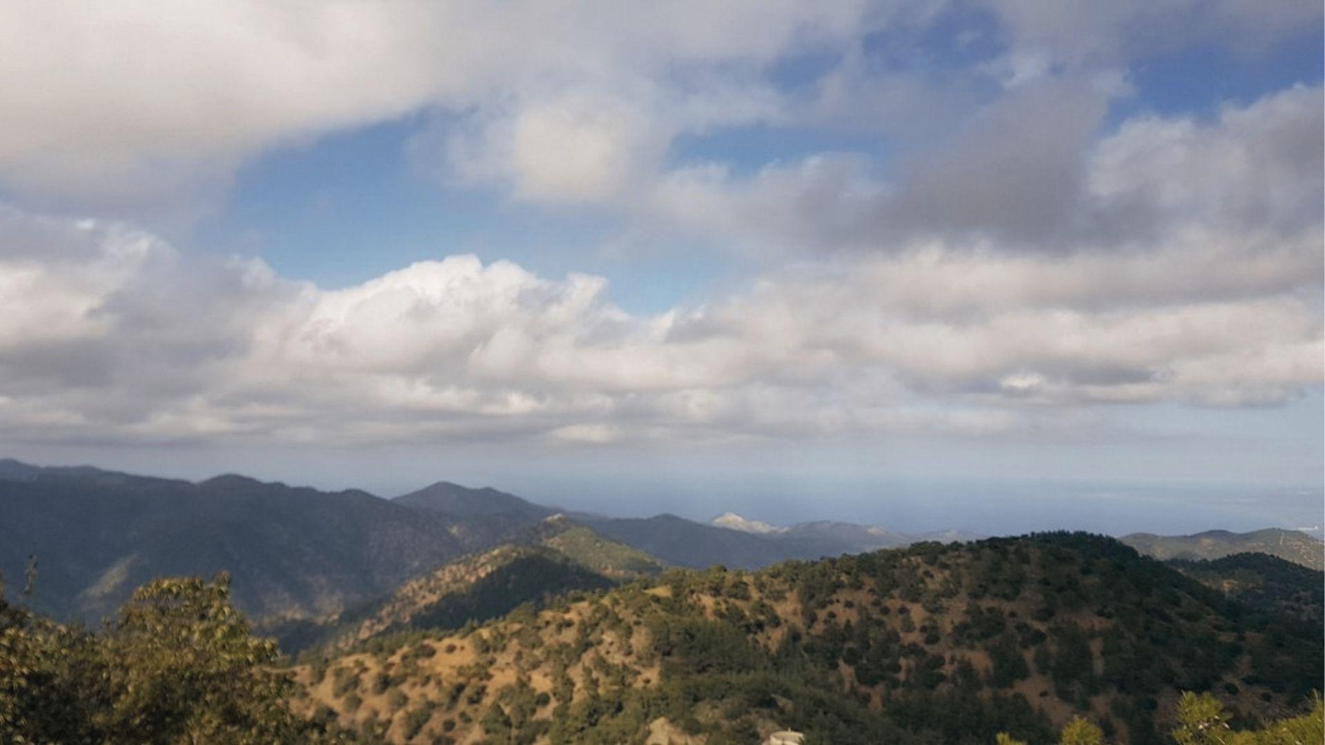 Troodos Mountains, Cyprus under soft clouds, a peaceful mountain view hiding Europe’s untouched trails.