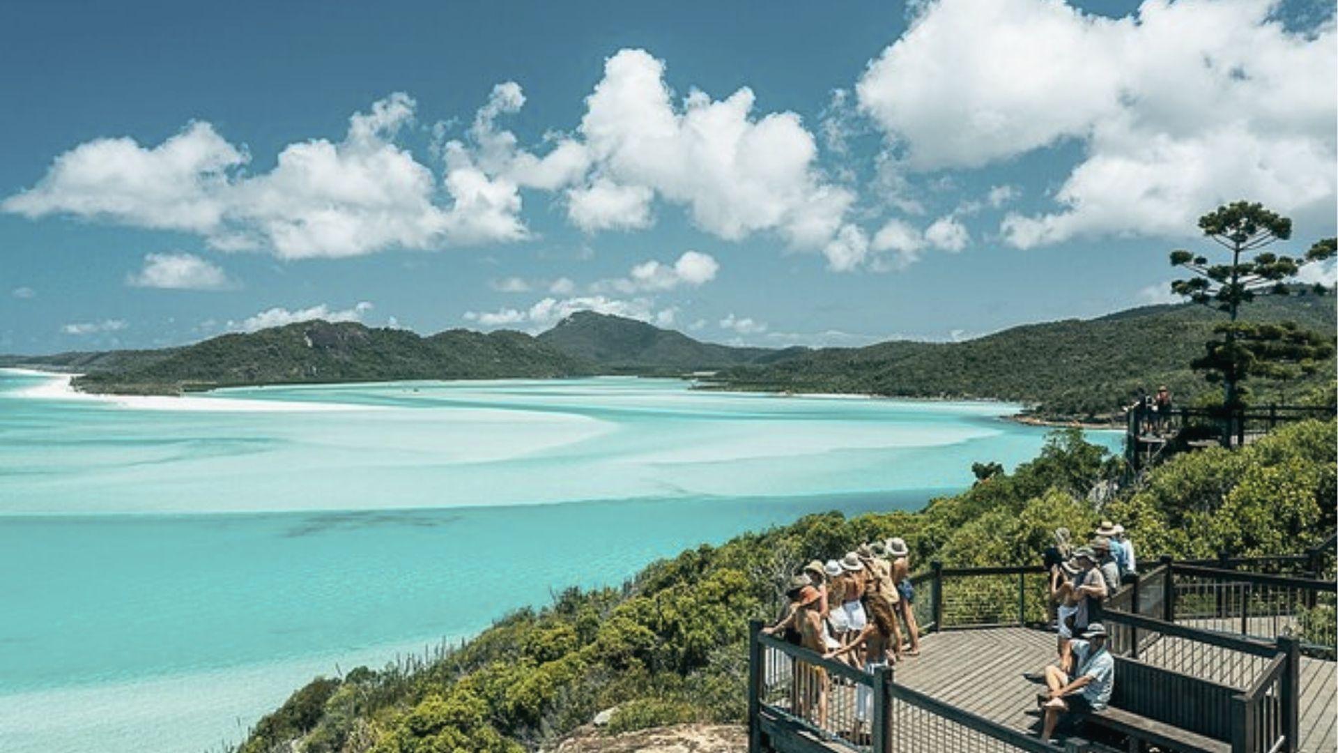 Hike to Whitehaven Beach lookout in the Whitsundays, view swirling silica sand and turquoise water.