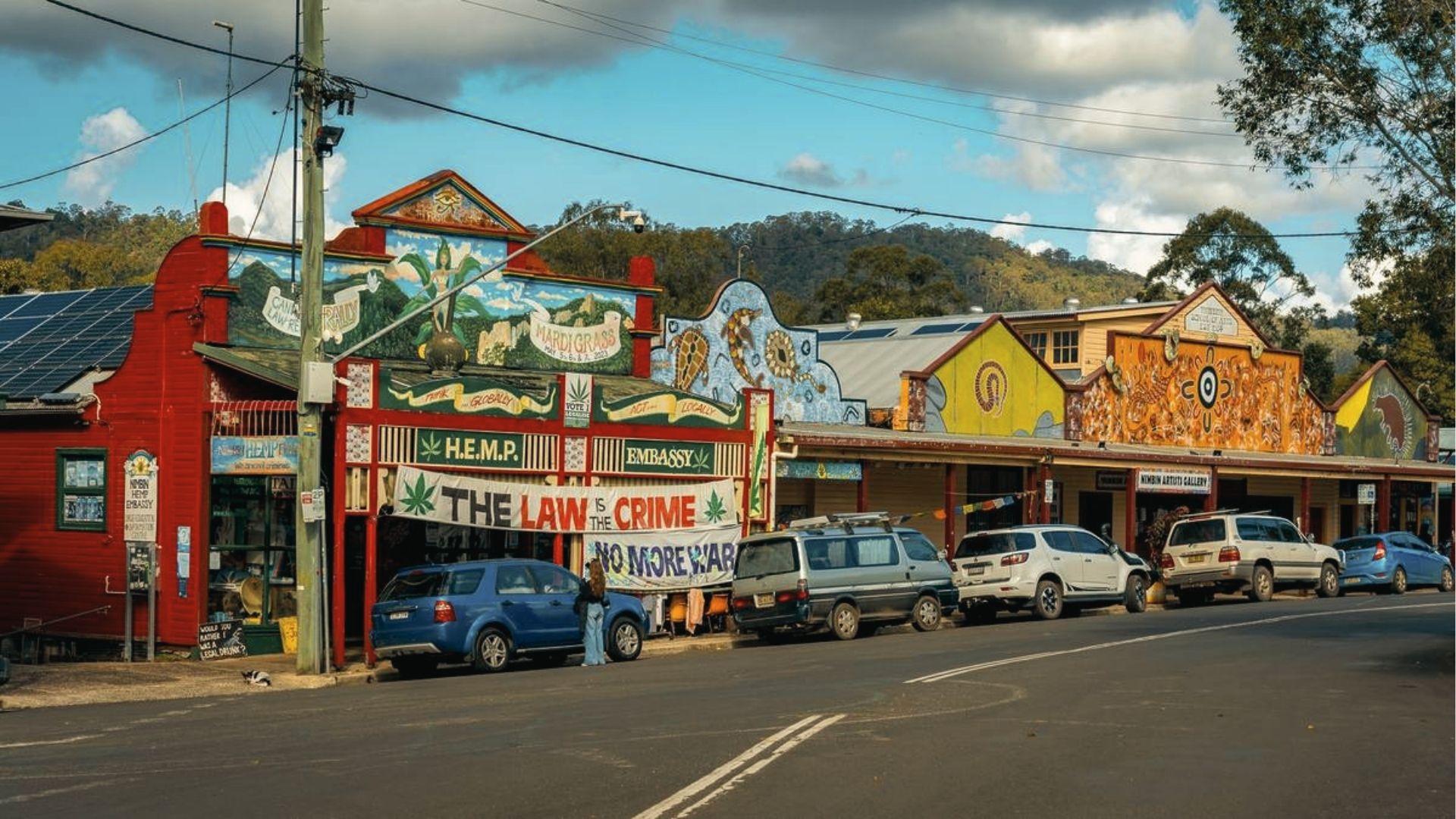 Visit Nimbin’s colorful main street murals and HEMP Embassy, browse quirky shops and street art.