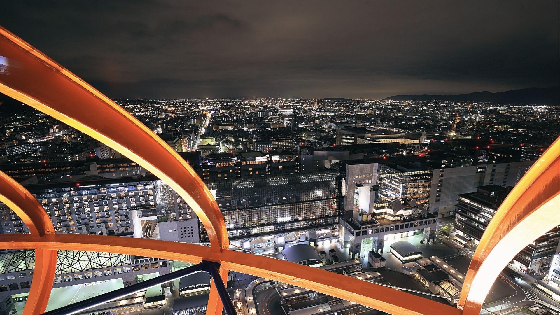 Catch panoramic night views from Kyoto Tower, spot the city lights and train station below.