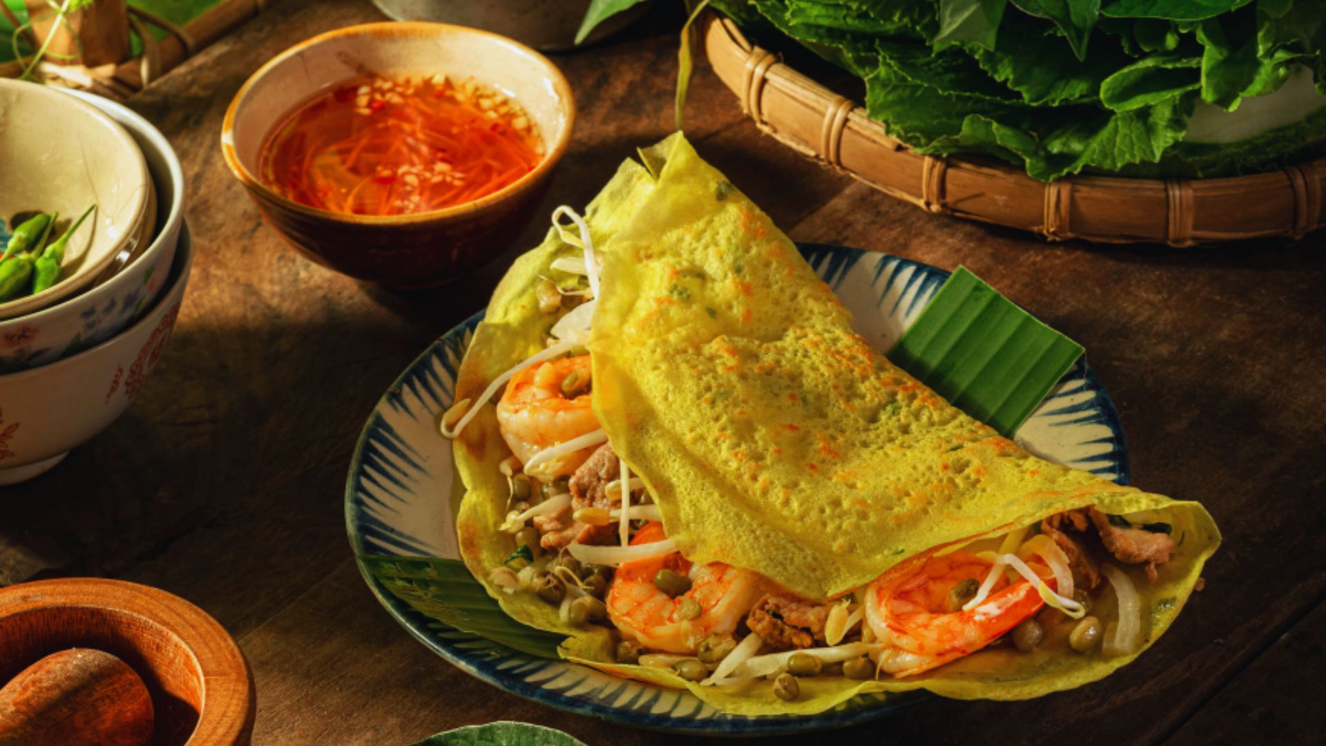 A plate featuring a wrap filled with shrimp and colorful vegetables, ready to be enjoyed.