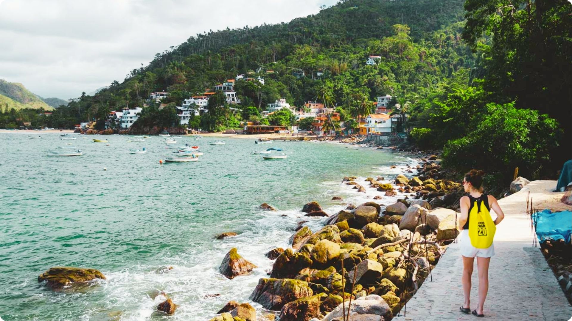 Walk the south shore promenade past small fishing villages tucked into jungle-covered hills